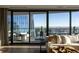 Living area with floor to ceiling windows and access to a balcony at 1133 14Th St # 4350, Denver, CO 80202