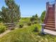 Backyard with grass, trees, shrubs, and view at 3216 Yale Dr, Broomfield, CO 80023