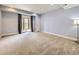 Bedroom featuring a sliding glass door and light blue walls at 3216 Yale Dr, Broomfield, CO 80023