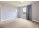Bedroom with a window, light blue walls, and wall art at 3216 Yale Dr, Broomfield, CO 80023
