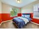 Vibrant bedroom with a half-wall accent and plenty of natural light at 3216 Yale Dr, Broomfield, CO 80023