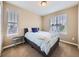 Cozy bedroom with bright windows and a comfortable bed, perfect for relaxation at 3216 Yale Dr, Broomfield, CO 80023