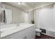 Clean bathroom with a tub-shower combo, white vanity, and neutral tile at 12205 Race St, Northglenn, CO 80241