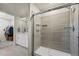 Modern bathroom featuring a glass-enclosed shower and a sleek vanity at 12205 Race St, Northglenn, CO 80241