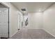 Spacious hallway with neutral carpet leading to various rooms in the home at 12205 Race St, Northglenn, CO 80241