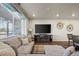 Well-lit living room features stylish furniture, window with curtains, and decorative accents that add warmth and personality at 12205 Race St, Northglenn, CO 80241