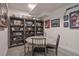 Finished basement with a round table and chairs, and gray shelves at 481 Woodroot Cir, Castle Rock, CO 80104