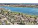 Stunning aerial view of lakeside neighborhood; serene lake view with beautiful homes at 8312 S Peninsula Dr, Littleton, CO 80120