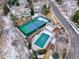 Aerial view of community amenities including a pool, tennis court and outdoor entertaining spaces at 8312 S Peninsula Dr, Littleton, CO 80120