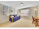 Bedroom with ample light, daybed, wooden floors and built in shelves at 8312 S Peninsula Dr, Littleton, CO 80120
