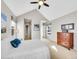 Bright bedroom with natural light, ceiling fan, and neutral color palette at 8312 S Peninsula Dr, Littleton, CO 80120