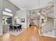 Elegant dining room with hardwood floors, chandelier lighting, and large windows at 8312 S Peninsula Dr, Littleton, CO 80120