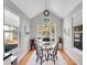 Sun-filled dining area features a glass table and windows offering picturesque neighborhood views at 8312 S Peninsula Dr, Littleton, CO 80120