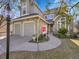 Beautiful two-story house with stone accents, updated siding, a walkway, and manicured landscaping at 8312 S Peninsula Dr, Littleton, CO 80120