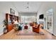 Inviting living room featuring a cozy fireplace, comfortable seating, and hardwood flooring at 8312 S Peninsula Dr, Littleton, CO 80120