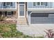 Close up of a home's front door and entrance, showcasing the architecture and design details of the exterior at 11225 W 102Nd Pl, Westminster, CO 80021