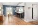 Charming kitchen with a center island, wood floors, modern appliances, and ample natural light at 11225 W 102Nd Pl, Westminster, CO 80021