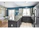 Spacious kitchen with center island, granite countertops, and stainless steel appliances at 11225 W 102Nd Pl, Westminster, CO 80021
