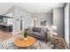 Bright living room featuring a comfortable couch, stylish rug, and contemporary decor at 11225 W 102Nd Pl, Westminster, CO 80021