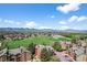 Beautiful aerial view showcasing the community, green space, and mountain views on a sunny day at 4899 S Dudley St # 19, Littleton, CO 80123