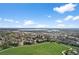 Stunning aerial view showcasing community, green space, and water, highlighting the desirable location at 4899 S Dudley St # 19, Littleton, CO 80123