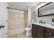 Clean bathroom with tiled shower, vanity and modern fixtures plus updated flooring at 4899 S Dudley St # 19, Littleton, CO 80123
