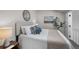 Bright bedroom with decorative pillows, stylish bedspread, and ample natural light at 4899 S Dudley St # 19, Littleton, CO 80123