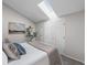 Bright bedroom featuring a skylight, plush pillows and neutral tones at 4899 S Dudley St # 19, Littleton, CO 80123