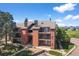 Beautiful exterior view of the building with multiple balconies and mature trees, creating a welcoming atmosphere at 4899 S Dudley St # 19, Littleton, CO 80123