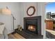 Close up of the modern fireplace with stylish decor and a patio view at 4899 S Dudley St # 19, Littleton, CO 80123