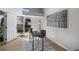 Well-lit home office with a modern desk and balcony access at 4899 S Dudley St # 19, Littleton, CO 80123