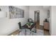 Bright home office space with modern desk, chair, area rug and stylish artwork above at 4899 S Dudley St # 19, Littleton, CO 80123