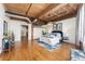 Large bedroom featuring exposed wood ceiling, hardwood floors and exposed duct work at 1616 14Th St # 4E, Denver, CO 80202