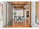 Dining area with hardwood floors, exposed ductwork, and a modern table setting at 1616 14Th St # 4E, Denver, CO 80202