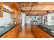 Sleek, modern kitchen with updated appliances, granite countertops, hardwood floors, and exposed ductwork at 1616 14Th St # 4E, Denver, CO 80202