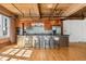 Modern kitchen with a breakfast bar, stainless steel appliances, and an open floorplan at 1616 14Th St # 4E, Denver, CO 80202