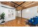 Bright living room featuring hardwood floors, exposed ductwork, modern art, and contemporary furnishings at 1616 14Th St # 4E, Denver, CO 80202