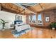 Spacious main bedroom features exposed ceilings, hardwood floors, and three windows at 1616 14Th St # 4E, Denver, CO 80202