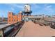 Spacious rooftop deck offering scenic views, lounge seating, and an ideal space for outdoor relaxation at 1616 14Th St # 4E, Denver, CO 80202