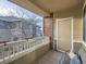 Cozy balcony with seating, decorative pillows and view of the neighborhood and a storage closet at 8481 W Union Ave # 4-203, Littleton, CO 80123