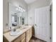 Functional bathroom featuring double sinks and good lighting, adding convenience to your daily routine at 8481 W Union Ave # 4-203, Littleton, CO 80123