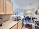 Kitchen sink area with view to dining room and living spaces at 8481 W Union Ave # 4-203, Littleton, CO 80123