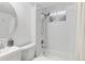 Basement bathroom with white tile and a tub/shower combo at 6524 Teller St, Arvada, CO 80003