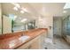 Luxurious bathroom with skylights, double sinks, stylish vanity and marble countertops at 581 Garfield St, Denver, CO 80206
