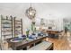 This dining room features a large table setting and kitchen island with bar seating, providing ample room for gathering at 581 Garfield St, Denver, CO 80206