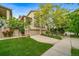 Attractive home with a stone and stucco exterior, neat landscaping, and an ample driveway leading to a two-car garage at 581 Garfield St, Denver, CO 80206