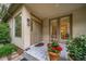 Welcoming front porch with decorative tile, inviting entryway, and charming potted plants, enhancing curb appeal at 581 Garfield St, Denver, CO 80206