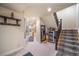 Lower level hallway with patterned stairs, wine refrigerator, and easy access to storage at 581 Garfield St, Denver, CO 80206