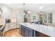 Bright kitchen featuring an island with seating and stainless steel appliances at 581 Garfield St, Denver, CO 80206