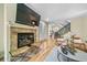 Comfortable living room with fireplace, large TV and an open staircase at 581 Garfield St, Denver, CO 80206